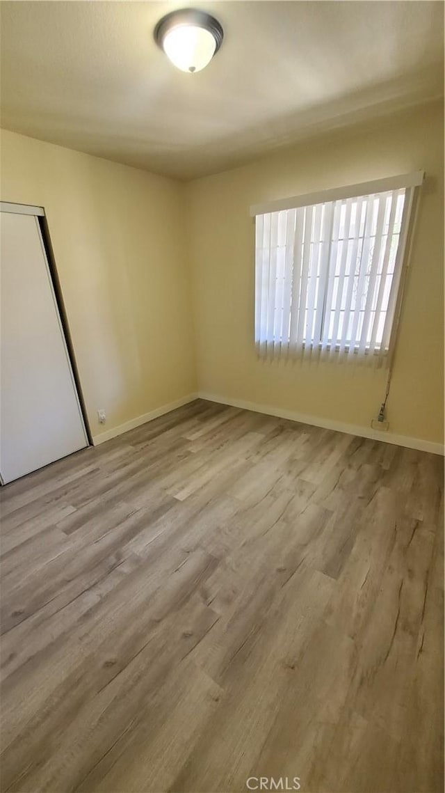 44709 6th St E, Lancaster, CA 93535 - spare room with wood finished floors and baseboards