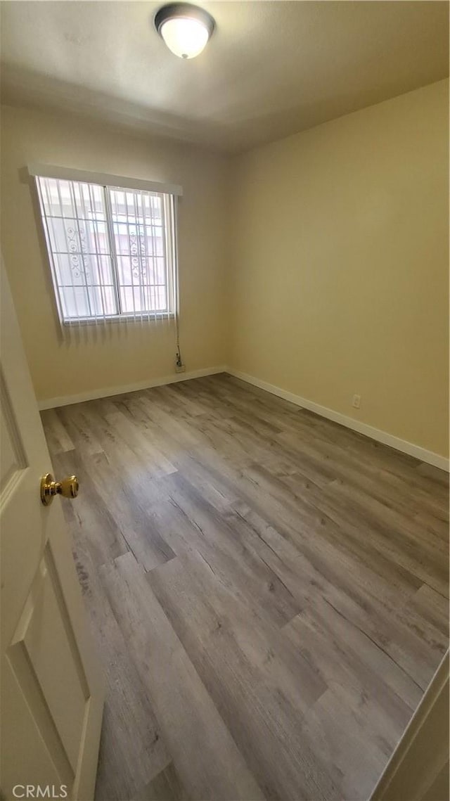 44709 6th St E, Lancaster, CA 93535 - unfurnished room with wood finished floors and baseboards