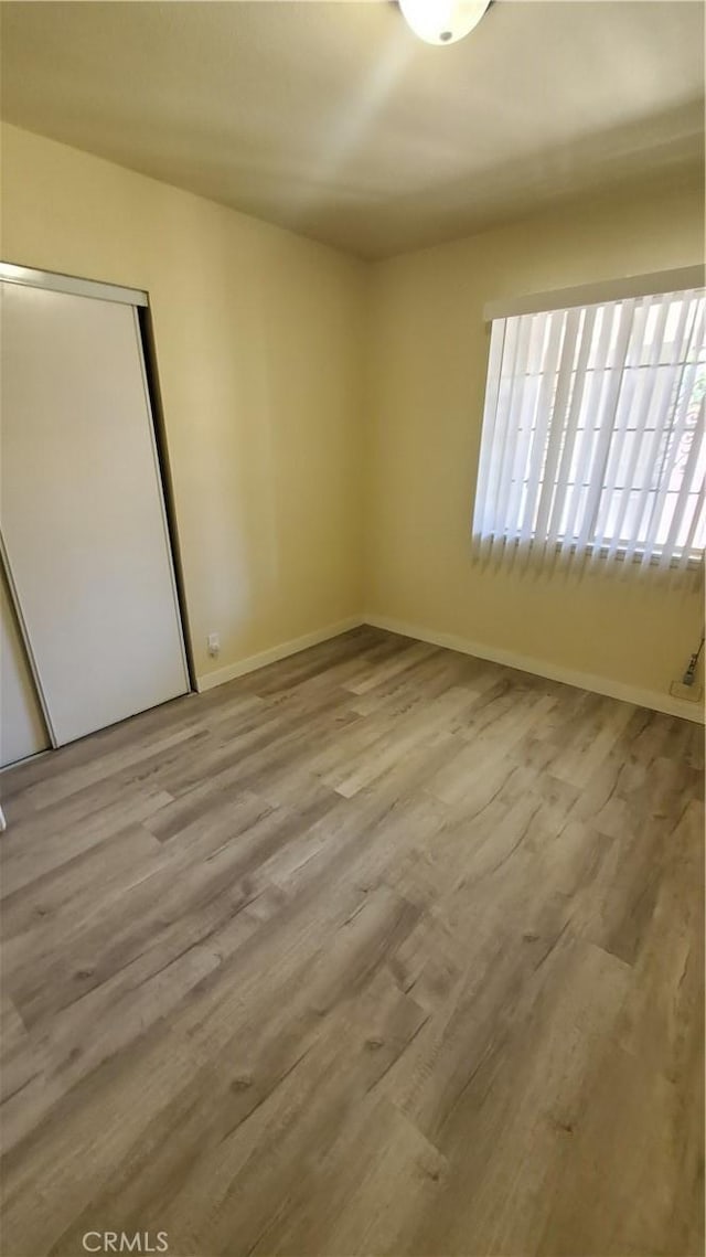 44709 6th St E, Lancaster, CA 93535 - unfurnished room with wood finished floors and baseboards