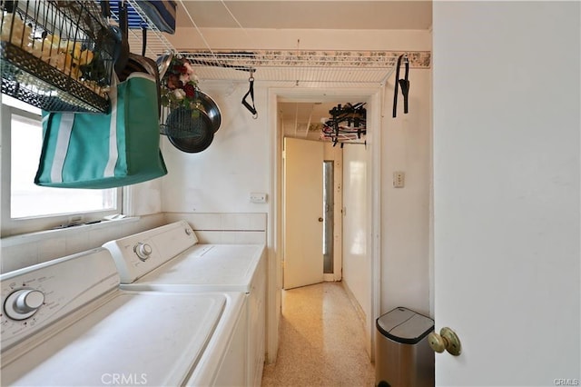 clothes washing area with independent washer and dryer