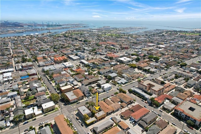 aerial view of property and surrounding area with a large body of water