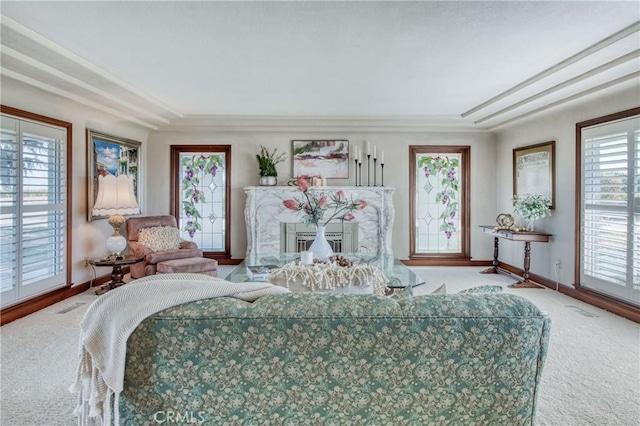 living room featuring carpet flooring and baseboards