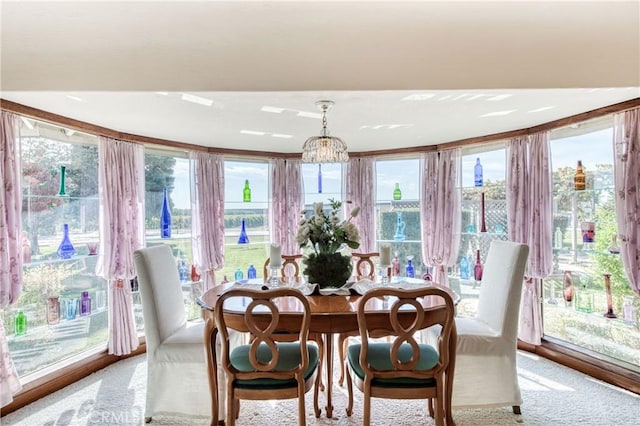 dining space with light colored carpet and plenty of natural light