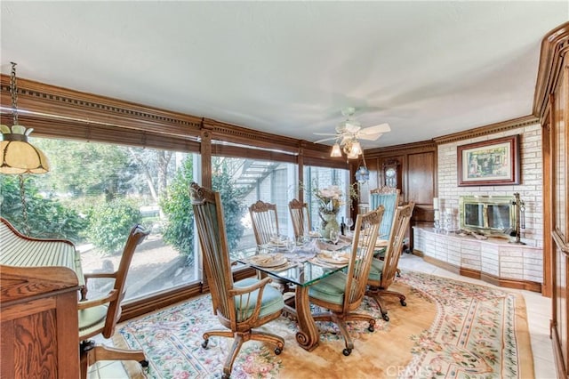 dining space featuring a ceiling fan and light tile patterned floors