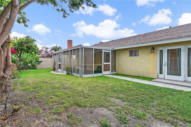 20672 Chaucer Ln, Huntington Beach, CA 92646 - back of house with stucco siding and a sunroom