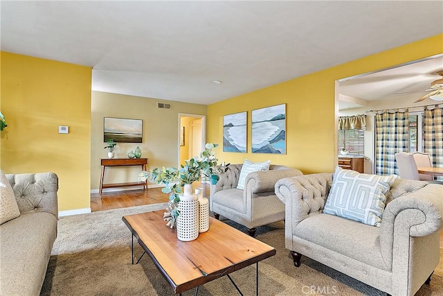 20672 Chaucer Ln, Huntington Beach, CA 92646 - living room with a ceiling fan, carpet flooring, and baseboards