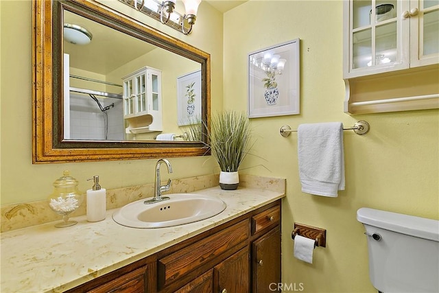 20672 Chaucer Ln, Huntington Beach, CA 92646 - bathroom featuring toilet, vanity, and a shower