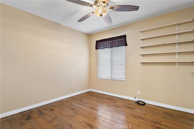 20672 Chaucer Ln, Huntington Beach, CA 92646 - unfurnished room featuring baseboards, hardwood / wood-style floors, and a ceiling fan