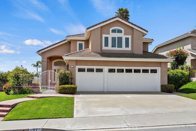 27 High Blf, Laguna Niguel, CA 92677 - traditional-style home with concrete driveway, an attached garage, stucco siding, a tile roof, and a gate