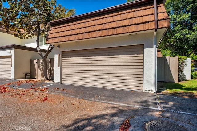 garage featuring fence