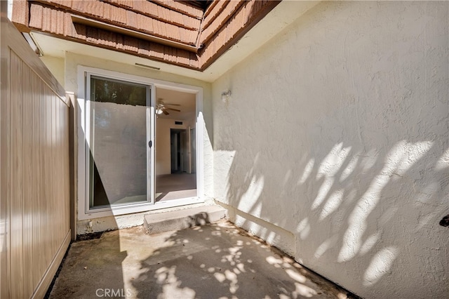 property entrance featuring stucco siding