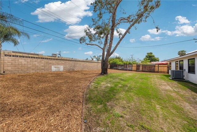 view of yard featuring central AC unit