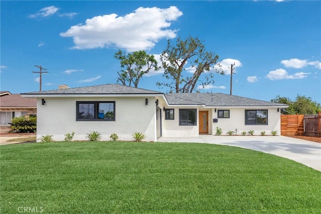 ranch-style house with stucco siding and driveway