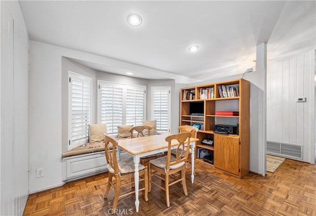 dining space with recessed lighting and baseboards