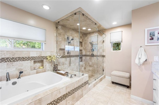 full bath featuring a shower stall, a bath, baseboards, vanity, and recessed lighting