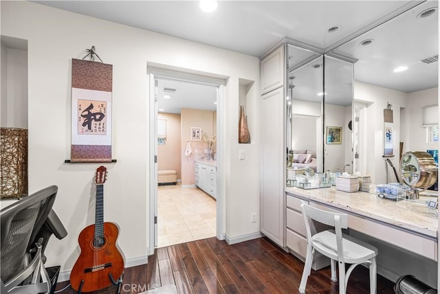 bathroom with vanity, wood finished floors, and recessed lighting