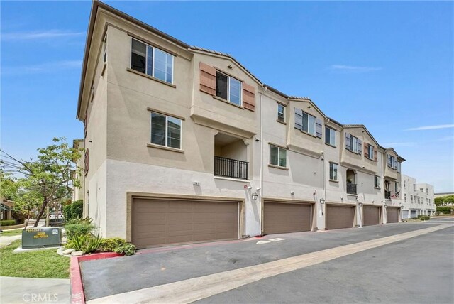 147 Royal Way, Upland, CA 91786 - view of building exterior featuring a garage and a residential view