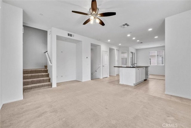147 Royal Way, Upland, CA 91786 - unfurnished living room with light carpet, recessed lighting, a ceiling fan, stairs, and baseboards
