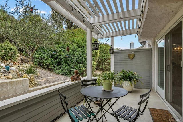balcony featuring a pergola