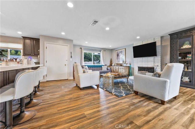340 Terry Way, La Habra, CA 90631 - living room featuring light wood-style flooring, recessed lighting, and a fireplace