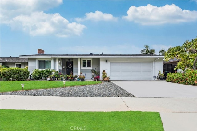 340 Terry Way, La Habra, CA 90631 - ranch-style house featuring a garage, concrete driveway, a front yard, and a chimney