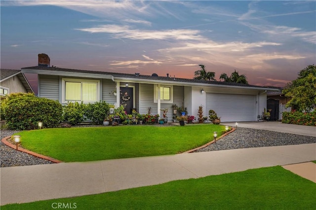 340 Terry Way, La Habra, CA 90631 - single story home with driveway, a lawn, a chimney, and a garage