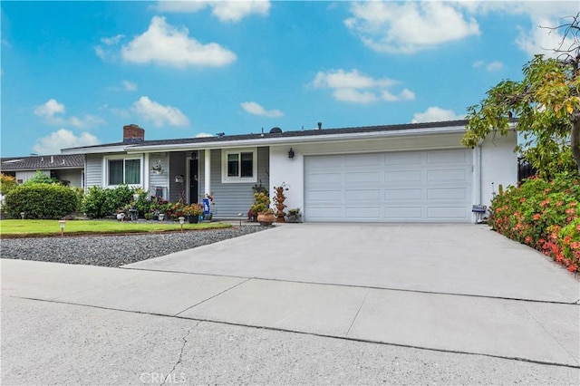 340 Terry Way, La Habra, CA 90631 - ranch-style home featuring driveway, a chimney, a garage, and stucco siding