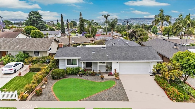 340 Terry Way, La Habra, CA 90631 - view of front of home with driveway, an attached garage, roof with shingles, and a residential view