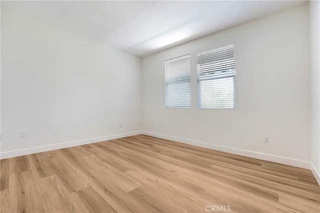 281 N Mar Vista Ave Unit 23, Pasadena, CA 91106 - unfurnished room with baseboards and light wood finished floors