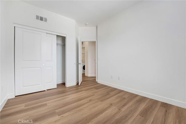 281 N Mar Vista Ave Unit 23, Pasadena, CA 91106 - unfurnished bedroom with baseboards, light wood-style floors, and a closet