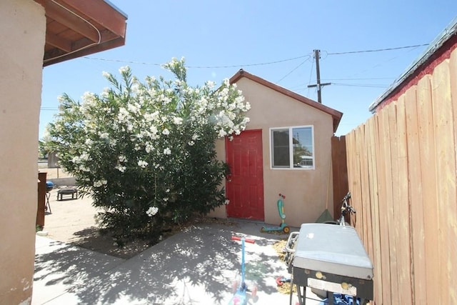 404 N 4th Ave, Barstow, CA 92311 - view of home's exterior featuring stucco siding and a patio area