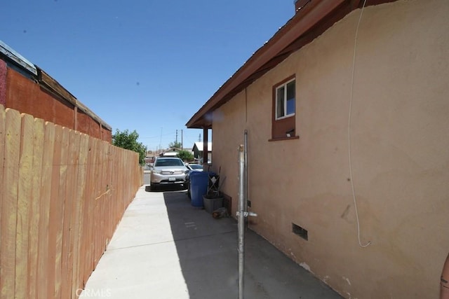 404 N 4th Ave, Barstow, CA 92311 - view of home's exterior with crawl space and stucco siding