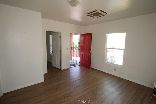 404 N 4th Ave, Barstow, CA 92311 - spare room featuring wood finished floors and baseboards