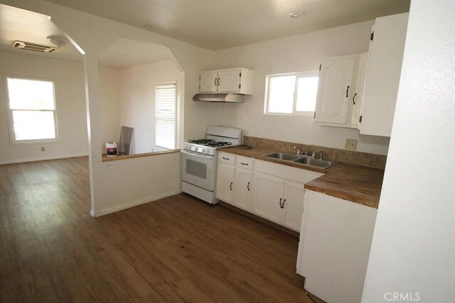 404 N 4th Ave, Barstow, CA 92311 - kitchen featuring gas range gas stove, a sink, under cabinet range hood, wooden counters, and dark wood-style floors