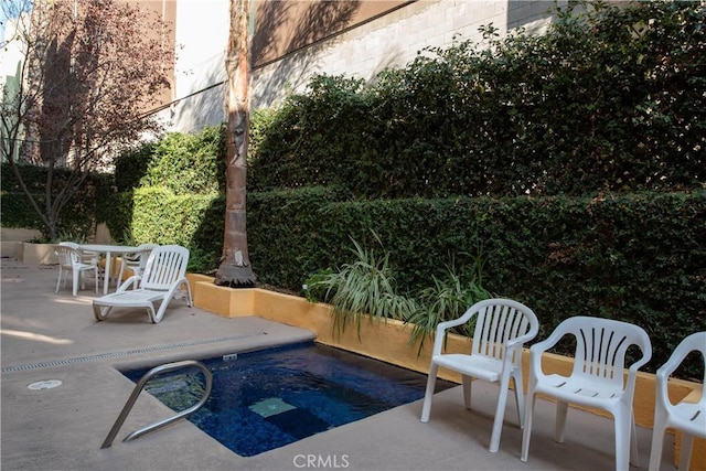 outdoor pool featuring a patio area