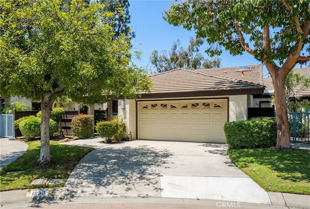 1233 N Diamond Bar Blvd, Diamond Bar, CA 91765 - view of front facade featuring an attached garage, a tile roof, stucco siding, and concrete driveway