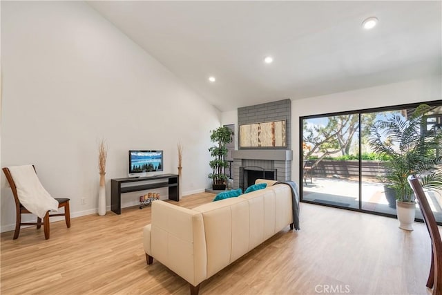 1233 N Diamond Bar Blvd, Diamond Bar, CA 91765 - living area with recessed lighting, light wood-style flooring, a fireplace, high vaulted ceiling, and baseboards