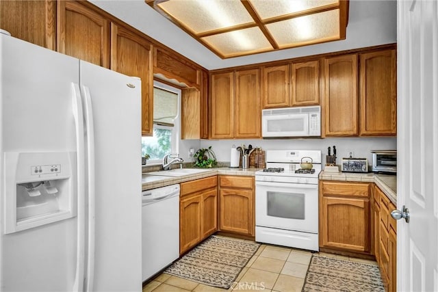 18863 Stonegate Rd, Hidden Valley Lake, CA 95467 - kitchen featuring white appliances, a sink, tile countertops, light tile patterned flooring, and brown cabinets