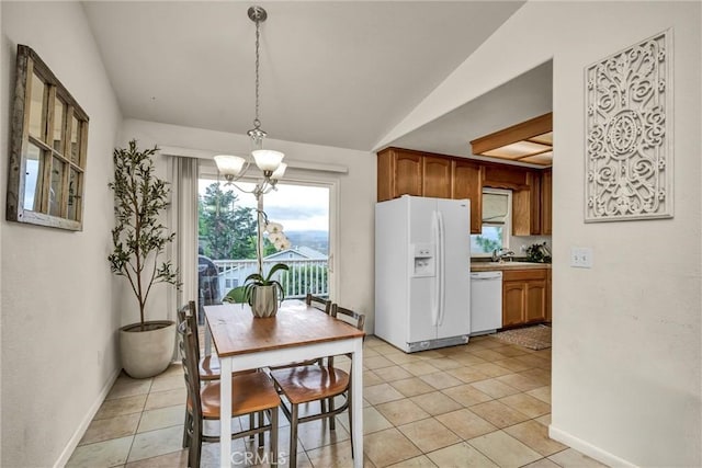 18863 Stonegate Rd, Hidden Valley Lake, CA 95467 - dining area with vaulted ceiling, baseboards, a chandelier, and light tile patterned flooring