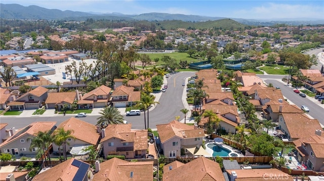 aerial view of residential area with a mountainous background
