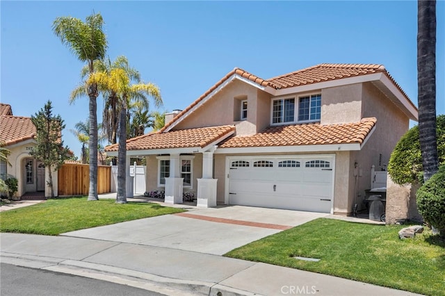 mediterranean / spanish-style house featuring a tile roof, stucco siding, and concrete driveway