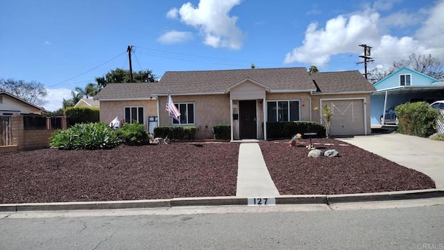 single story home with concrete driveway, a garage, stucco siding, and fence