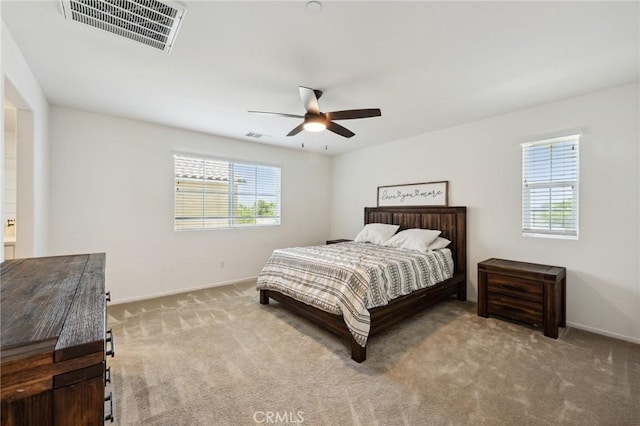 148 Camden Ct, Perris, CA 92571 - carpeted bedroom featuring multiple windows, baseboards, and a ceiling fan