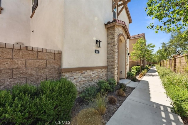 148 Camden Ct, Perris, CA 92571 - view of side of property with stucco siding and stone siding