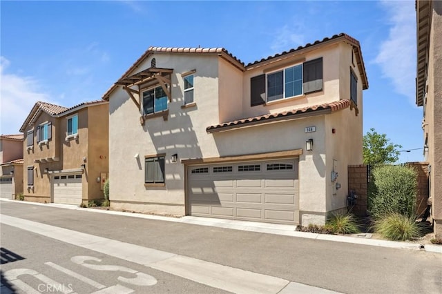 148 Camden Ct, Perris, CA 92571 - mediterranean / spanish house featuring a garage, stucco siding, and a tiled roof