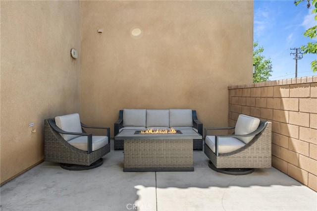 148 Camden Ct, Perris, CA 92571 - view of patio / terrace with an outdoor living space with a fire pit