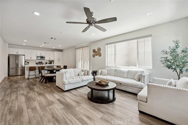 148 Camden Ct, Perris, CA 92571 - living room featuring wood finished floors, recessed lighting, and ceiling fan