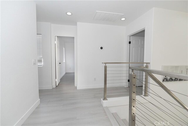 43250 Lago Brezza Dr, Indio, CA 92203 - corridor with an upstairs landing, baseboards, recessed lighting, and light wood-style flooring
