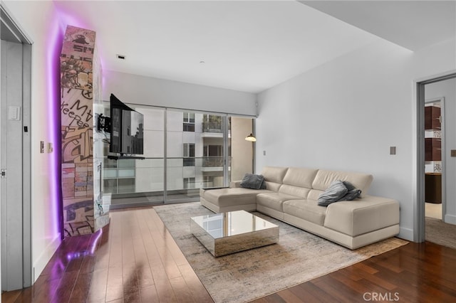 living room with wood finished floors and baseboards
