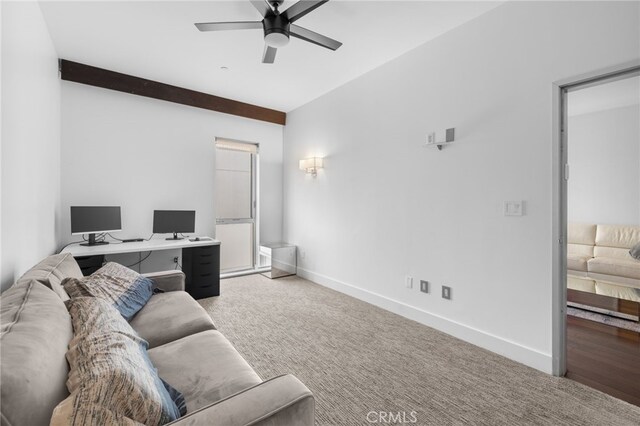 living room featuring a ceiling fan, an office area, carpet, and baseboards